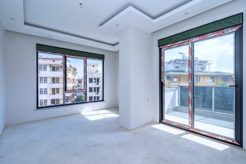 Neue 2+1 Wohnung in einer Luxusanlage im Zentrum von Alanya - Photo 19